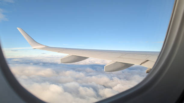 Jet wing Close up of jet wing in sky airplane part stock pictures, royalty-free photos & images