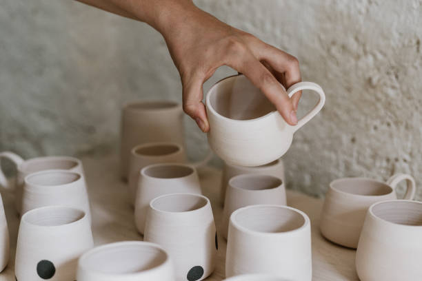 istock Woman examing her clay pots 1461044304