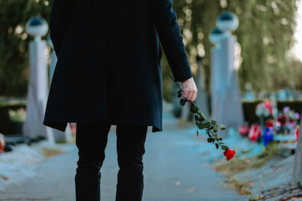 istock Man in the cemetery 1461045266