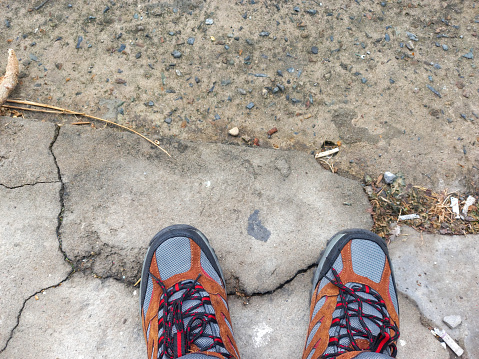 shoes on cracked road, mountain shoes