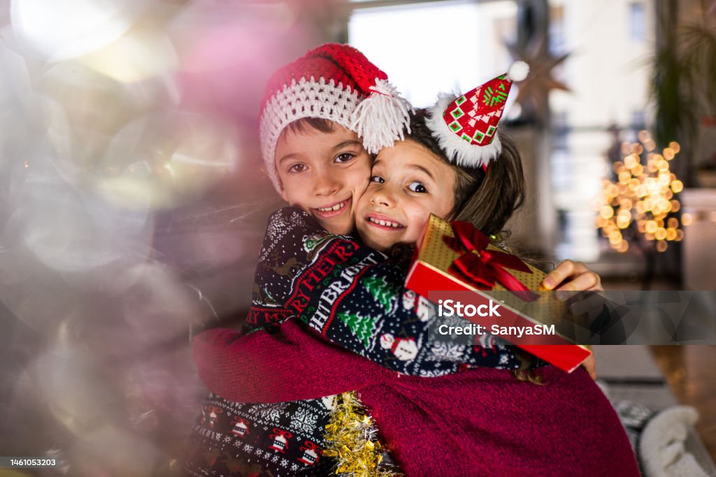 Happy children on Christmas Eve Beautiful toddler boy and girl on a New Year’s Eve. Affectionate Stock Photo