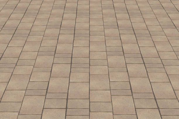 new paving made with stone blocks of rectangular shape in a pedestrian zone - driveway brick paving stone interlocked imagens e fotografias de stock
