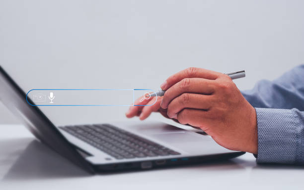 istock Businessman's hand holding a pen pointing to the Search Engine Optimization icon. Search for information using a website search. digital connection global network search for technology concept. 1461054268