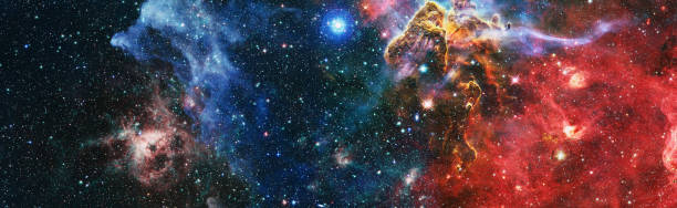 istock Nebula night starry sky in rainbow colors. Multicolor outer space. Star field and nebula in deep space many light years far from planet Earth. Elements of this image furnished by NASA. 1461055023