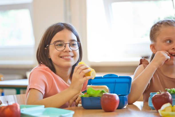 istock School girls having lunch 1461055681