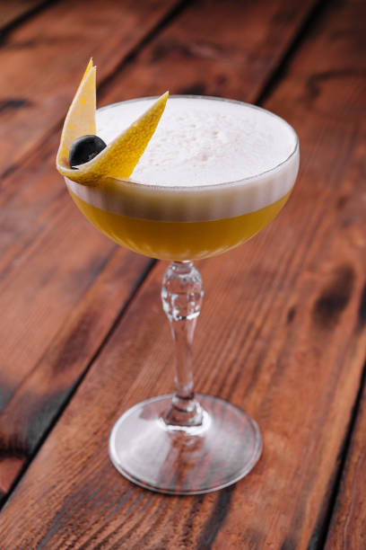 istock Glass of Ruby Cocktail garnished with orange zest 1461059198