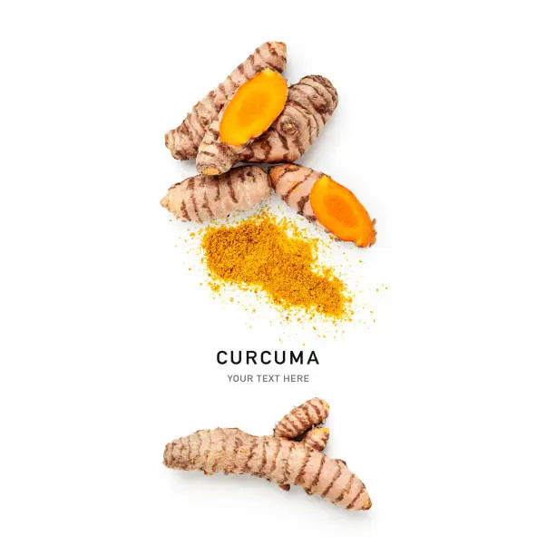 Photo of Turmeric root and curcuma powder isolated on white background