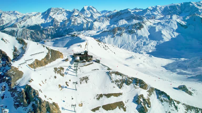 Courchevel, France: Aerial view of famous ski resort in French Alps (Savoie Alps) mountains in winter, sunny day with lot of snow - landscape panorama of Europe from above