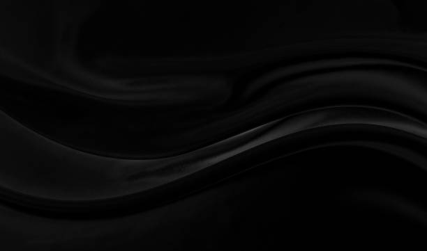 istock Black gray satin dark fabric texture luxurious shiny that is abstract silk cloth background with patterns soft waves blur beautiful. 1461066552