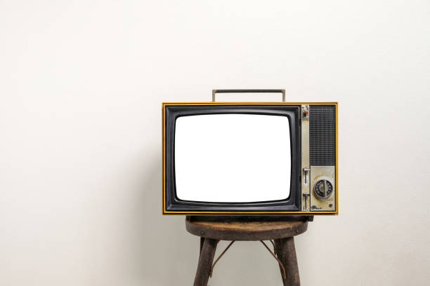istock Vintage old television cut out blank screen on bench on white wall background. 1461067166