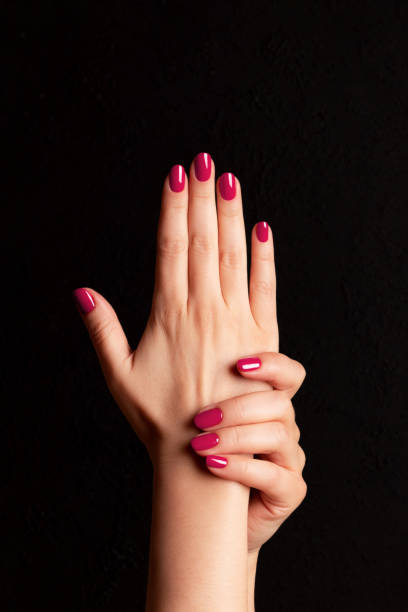 istock Female hands with viva magenta, pink nails 1461067707