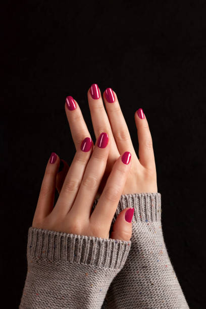 istock Female hands with viva magenta, pink nails 1461067778