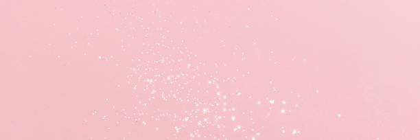 istock Sparkling silver glitter on pink background banner 1461068333