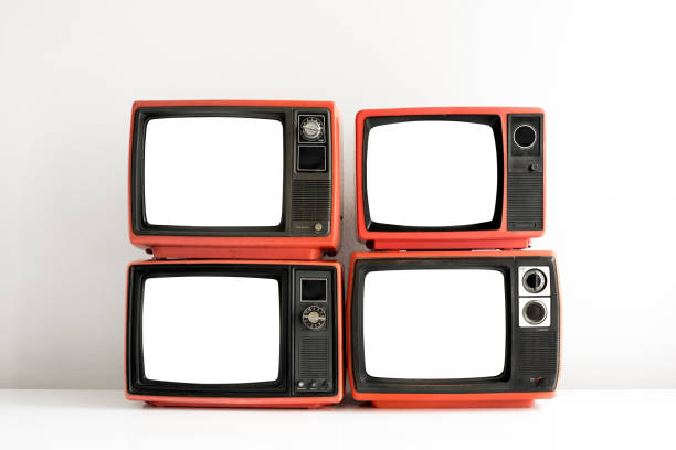 istock Pile of red old retro television cut out blank screen on white wall background, front view 1461068871