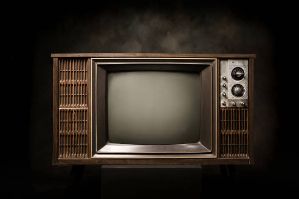 istock Retro old television with blank screen on a black background 1461068887