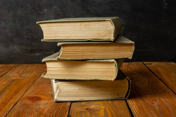istock Back to school concept. School supplies on black board background. 1461068899