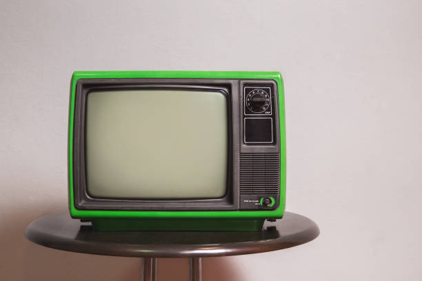 istock Old green TV on round table in the living room 1461069002