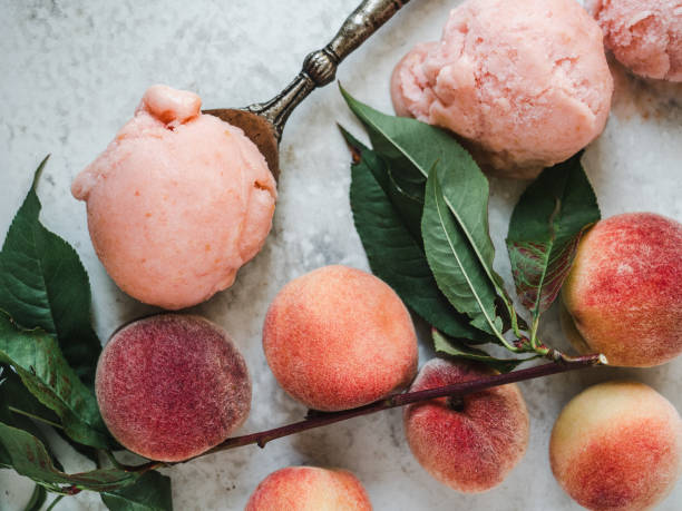 Homemade ice cream and ripe, juicy peaches