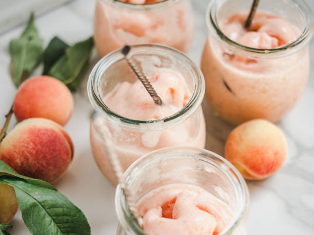 Homemade ice cream and ripe, juicy peaches