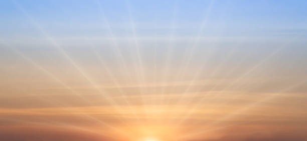 istock Real amazing panoramic sunrise or sunset sky with gentle colorful clouds. Long panorama, crop it. Evening sky scene with golden light from the setting sun 1461069278