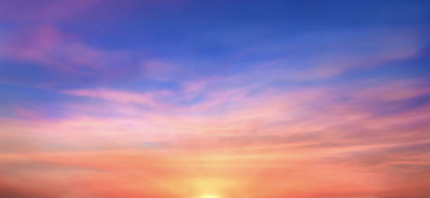 istock Real amazing panoramic sunrise or sunset sky with gentle colorful clouds. Long panorama, crop it. Evening sky scene with golden light from the setting sun 1461069282