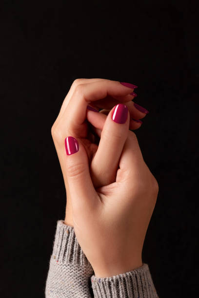 istock Female hands with viva magenta, pink nails 1461069347