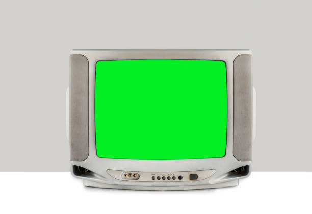 istock Silver analog old TV with green screen isolated on white table and gray background, clipping path 1461069372