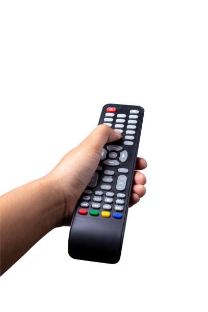 istock Woman hand holding TV remote control with clipping path isolated on white background. 1461069433
