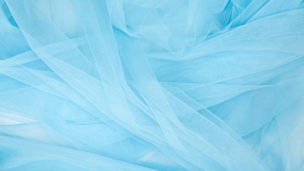 istock Beautiful layers of delicate light blue fabric background. 1461069569