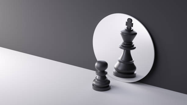 istock 3d render, chess game white pawn piece stands in front of the round mirror with reflection of black king. Contradiction or ambition metaphor. Perceptual distortion concept. Minimalist composition 1461072589