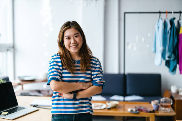 istock Female fashion designer in her loft studio 1461074024