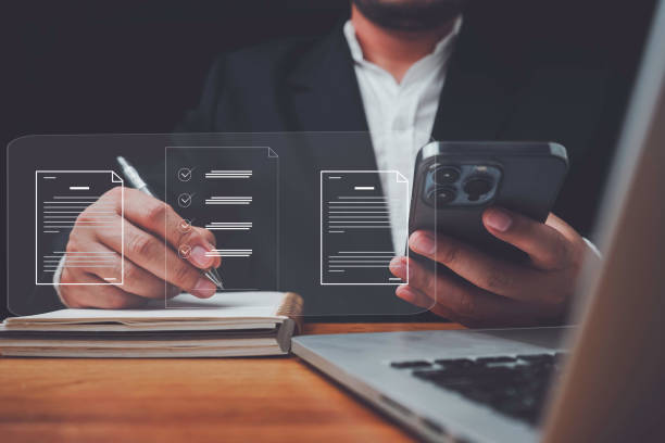 istock E-document management Paperless workplace, e-signing, electronic signature, document management man signs an electronic document on digital document by virtual notebook screen using a stylus pen. 1461078117