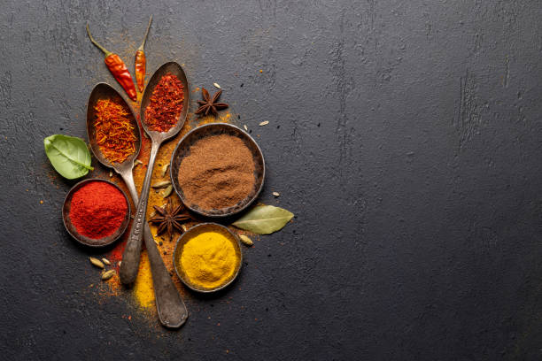 istock Various spices in bowls and spoons on stone table 1461078129
