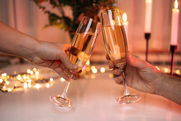 istock Couple toasting with white wine 1461078848