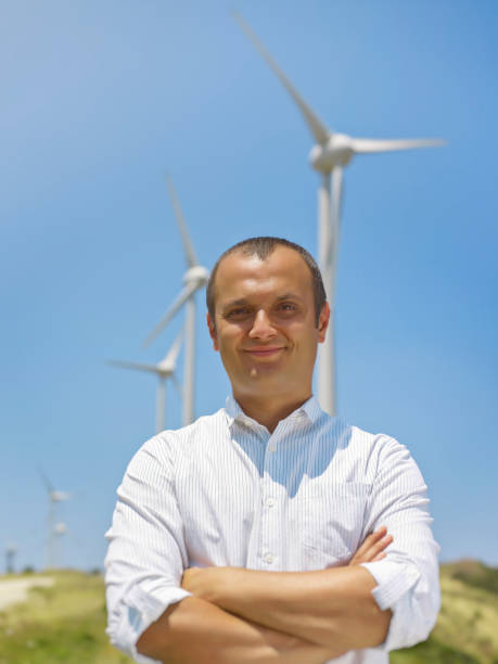 istock Businessman and wind turbines 1461080206