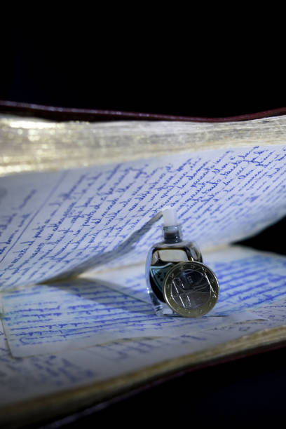 istock old manuscript handwritten and euro coin 1461088092