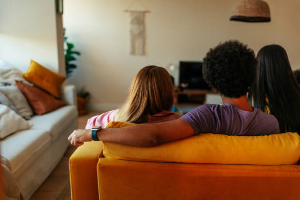 istock Diverse people watching tv indoors. 1461094805