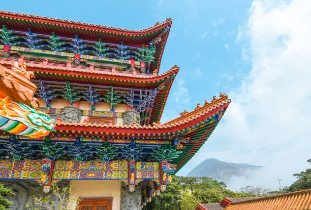 Photo of Colorful Chinese temple roof with blue sky background, Hong Kong.