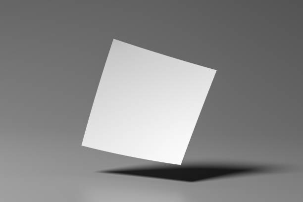 istock Square flyer paper mockup floating on gray background 1461098653