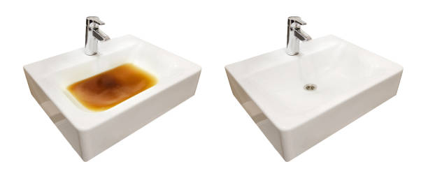 istock Blockage in the sink before and after the problem is resolved, isolated on a white background. Clog problems in the bathroom and toilet 1461098984