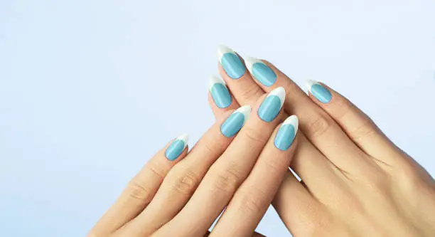 Manicure, Beautiful manicured womans nails with light blue nail polish
