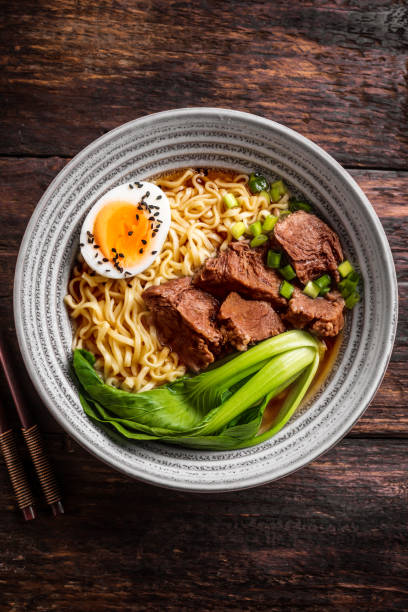 istock Ramen Asian noodles soup with meat 1461101368