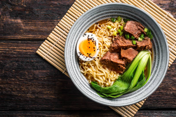istock Ramen Asian noodles soup with beef 1461101504