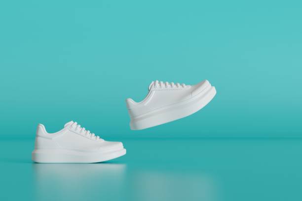 istock stylish white sneakers on a turquoise background. 3D render 1461102199