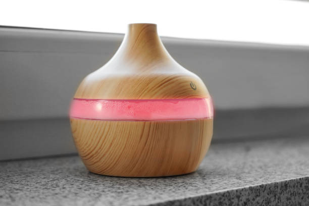 istock an air humidifier with ice backlight stands on the windowsill above the radiator 1461102425