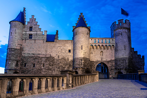 France - Sept 21, 2013: Castle or chateau of Sully-sur-Loire at sunset. This old castle is a famous landmark in France. Beautiful sunny view of the French castle on the water. Fairytale medieval castle in summer.