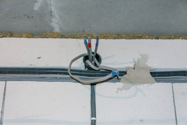istock Elecrician work. Installing wall electric outlet 1461103847