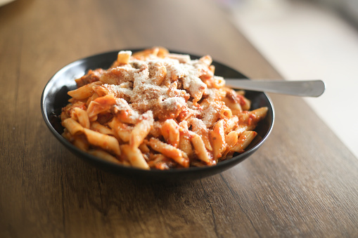 Pasta Penne Rigate with tuna and tomato sauce.
