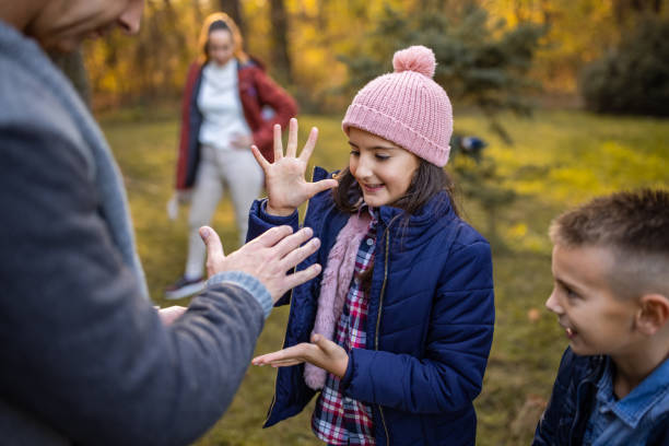 istock Dad and daughter are playing rock paper scissors 1461104966