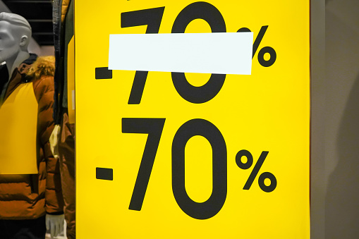 Discounts in the store -70%. Entrance to a clothing store.